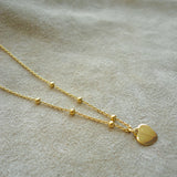COLLAR CORAZON PELOTITAS