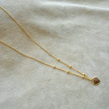 COLLAR CORAZON PELOTITAS
